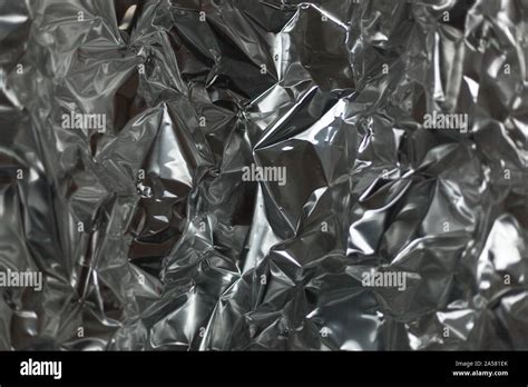 Full Frame Take Of A Sheet Of Crumpled Silver Aluminum Foil Background