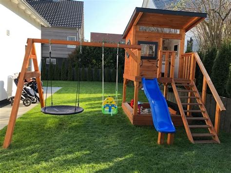 backyard playground  wooden swing set  blue