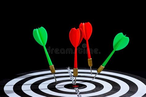 Red And Green Dart Arrow Hitting Target Center Is Dart Board Isolated