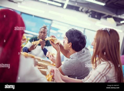 Friendly Diverse Multiethnic Business Team Eating Sharing Pizza