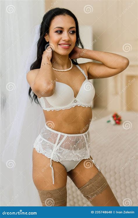 African American Bride In Lingerie And Veil In Morning Preparing For