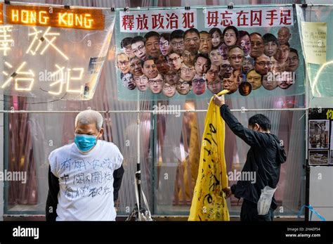 Pro Democracy Activist Koo Sze Yiu L Is Seen In Front A Banner With