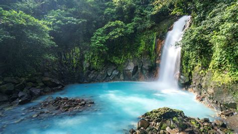 Catarata Del Rio Celeste Waterfall In Rainforest Tenorio Volcano