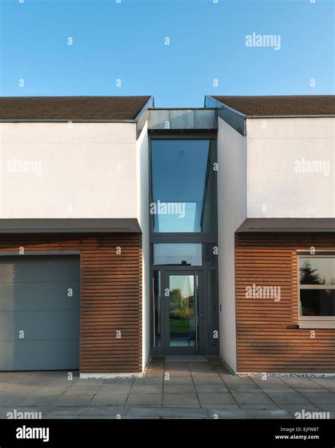 Detailed Front Elevation With Glass Connecting Passage At Entrance House Lus Poznan Poland