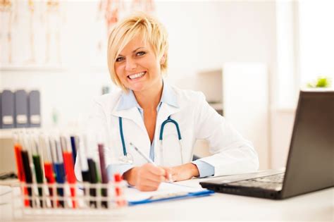 Free Photo Female Doctor Hard Working In Her Office