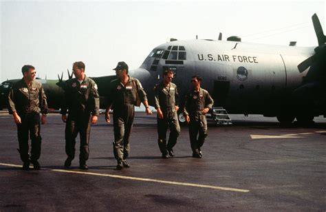 Aircrewmen Walk Across The Ramp After Arriving At The Kigali Airport