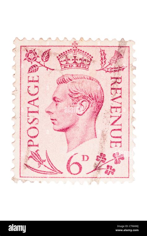 A King George Vi Six Pence Red 6d Postage Stamp On A White Background