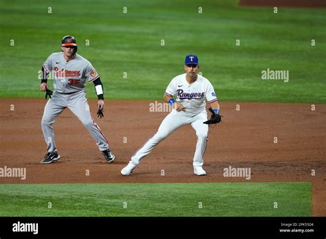 Texas Rangers First Baseman Nathaniel Lowe Defends Against A Hit As