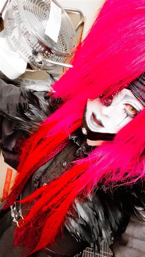 A Person With Pink Hair And Black Clothing