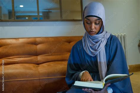 Muslim woman praying at home Stock Photo | Adobe Stock