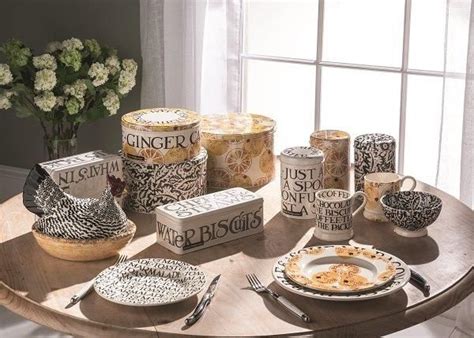 A Wooden Table Topped With Dishes And Cups