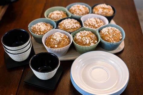 Premium Photo A Plate Of Muffins With Powdered Sugar On Top