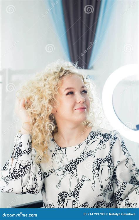 The Beautiful Blonde Admires Her Hair In A Beauty Salon Stock Image