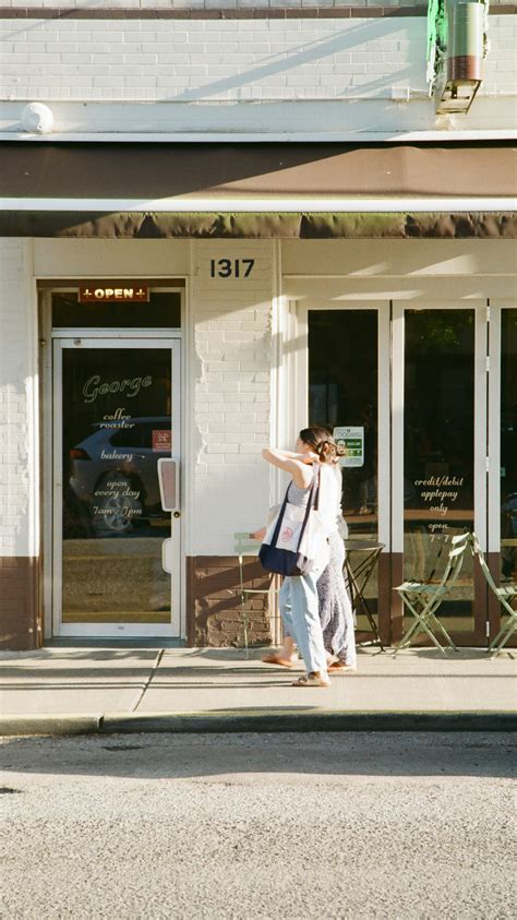 Two women walk past a bakery. photo – Free Coffee Image on Unsplash