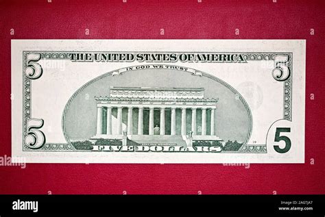 United States five-dollar bill features Lincoln Memorial on the back ...