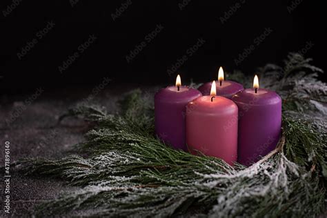 Christmas wreath with four burning purple advent candles. Stock Photo ...