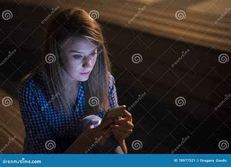 Upset Unhappy Woman Holding Cellphone On Gray Wall Background Stock