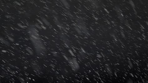 Slow Motion Footage Of Snow Falling Isolated On A Black Background