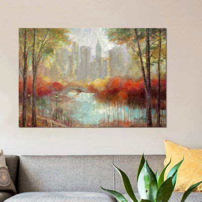 A Painting Hanging On The Wall Above A Couch In A Living Room Next To A