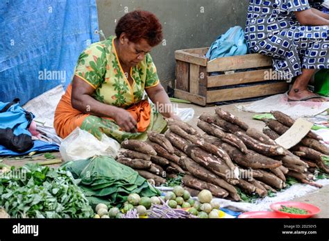 A Street Vendor Selling Casava A National Fiji Root Crop At A Fruit