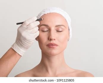 Beautician Touch Draw Correction Lines On Stock Photo