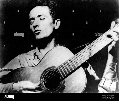 FILE This Undated File Photo Shows Folk Singer Woody Guthrie Playing