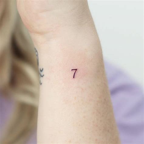 Minimalistic tattoo of the number "7" done on the