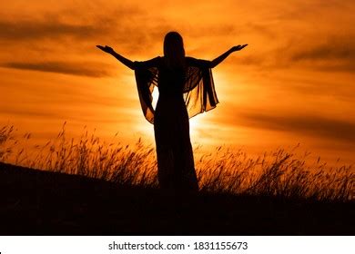 Silhouette Woman Arms Outstretched Looking Beautiful Stock Photo ...