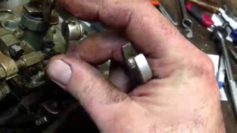 How To Remove The Carburetor From A 5 Hp Suzuki Spirt Outboard Motor