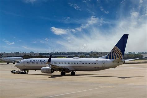 Huge Vehicle Pushing Back A Airplane United Airlines In Airport Houston