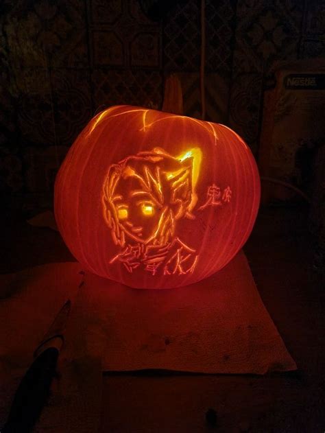 A Carved Pumpkin With An Image Of A Person On It