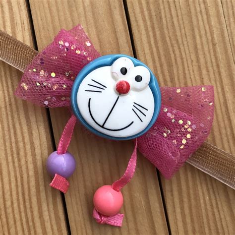 Kids Cartoon Doraemon Theme Pink Bow Rakhi | Buy Online Kids Rakhi