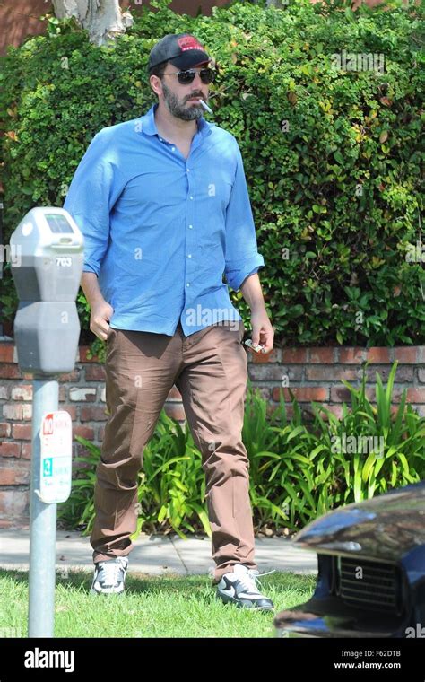 Ben Affleck smokes a cigarette as he leaves a medical building in
