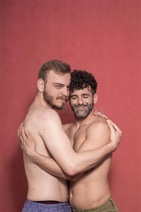 Gay Couple Hugging Each Other Eyes Closed And Looking To Camera Calm Stock Image Image Of