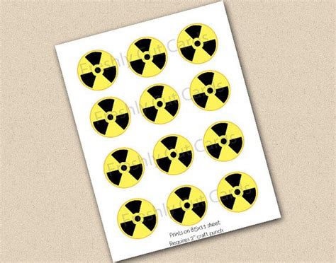 Yellow And Black Radioactive Symbol Stickers On A White Paper With The