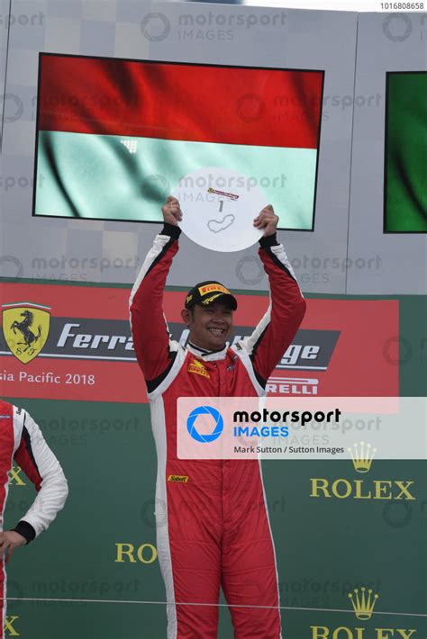 Race Winner Danindro Ariondito Ina Celebrates On The Podium With The