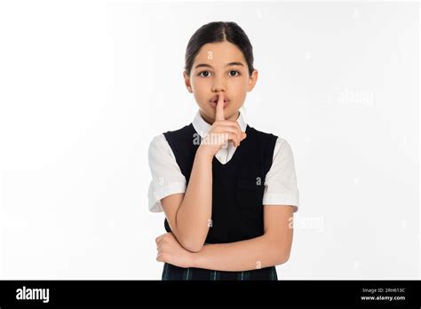 Brunette Schoolgirl Showing Hush Sign And Looking At Camera Isolated On White Shh Finger Near