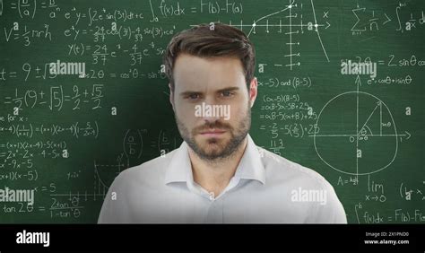 White Man Short Brown Hair And Beard In Front Of Chalkboard With