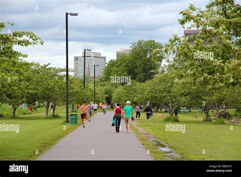 BOSTON, USA - JUNE 8, 2013: People visit Charles River esplanade park in Boston. Boston is the ...