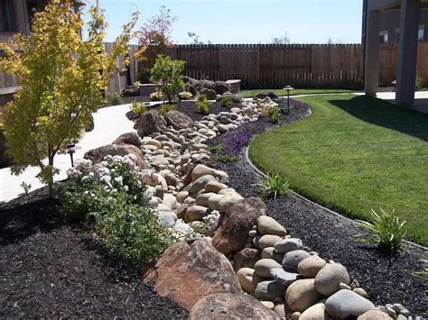 Landscape Designs That Prevent Flood Damage Dry Streambeds Landscape