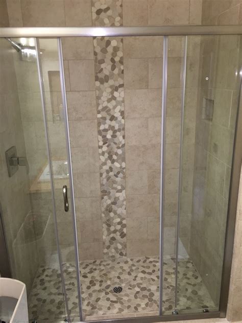 Gorgeous Shower Floor And Accent Using Sliced Java Tan And White Pebble