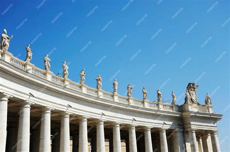 Premium Photo | Statues in St Peter Square Rome Italy with blue sky ...