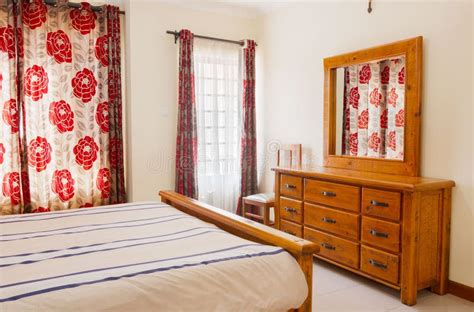 Interior Of A Cozy Hotel Room With Old Style Wooden Furniture Stock