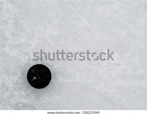 Hockey Puck On Ice Stock Photo (Edit Now) 128237069