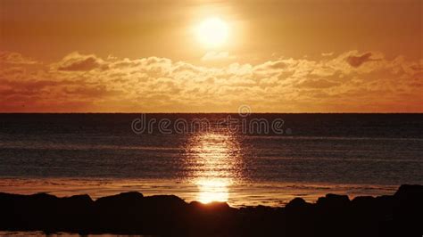 Dramatic Sea Sunset Burning Sky And Shining Waves Warm Clouds And