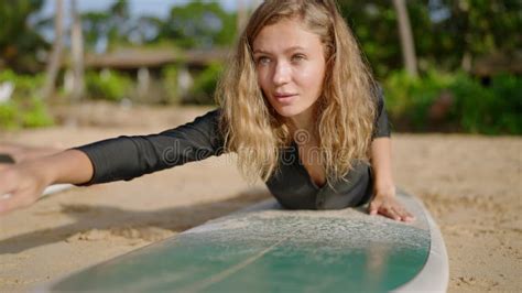 Beginner Surfer Female Takes Surf Lesson At Camp Retreat Slim Blonde Woman Gets On Surfboard