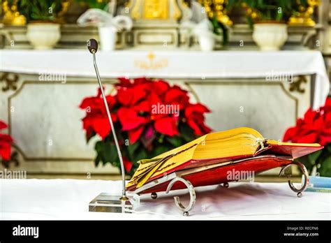 Holy Bible on altar in Catholic church Stock Photo - Alamy