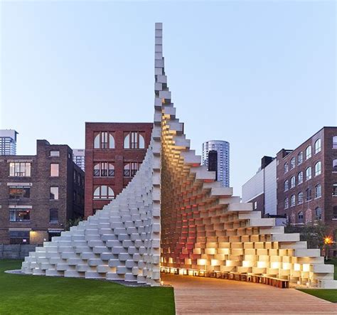 A Large White Building With Stairs Leading Up To It S Top And Bottom Floors