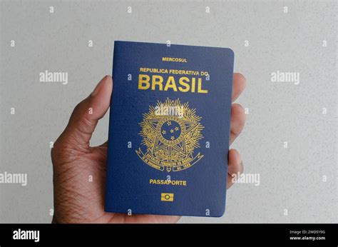 Close View Of The Brazilian Passport With Its Blue And Golden Cover Symbolizing The Diversity