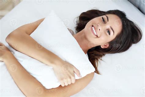 Young Beautiful Woman Waking Up In Her Bed Fully Rested 15765942 Stock